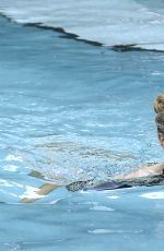 CHARLOTTE MCKINNEY in Bikini at a Pool in Miami 02/18/2017