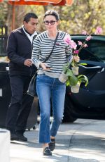 COURTENEY COX Shopping a Few Orchids at Farmer