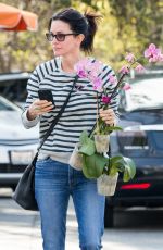 COURTENEY COX Shopping a Few Orchids at Farmer