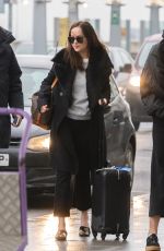 DAKOTA JOHNSON at Heathrow Airport in London 02/10/2017