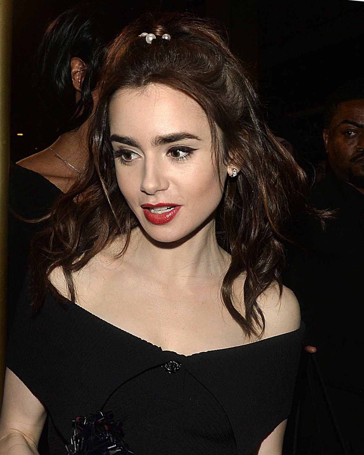 LILY COLLINS Leaves Charles Finch and Chanel Pre Oscar Awards Dinner in ...