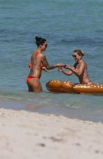 MARIA HERING and ISABEL QUESADA in Bikinis at a Beach in Miami 02/24/22017