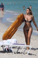 MARIA HERING and ISABEL QUESADA in Bikinis at a Beach in Miami 02/24/22017