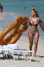 MARIA HERING and ISABEL QUESADA in Bikinis at a Beach in Miami 02/24/22017