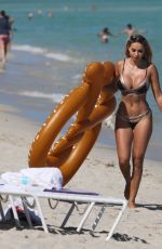 MARIA HERING and ISABEL QUESADA in Bikinis at a Beach in Miami 02/24/22017