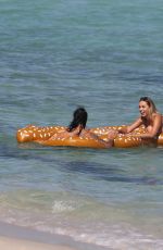 MARIA HERING and ISABEL QUESADA in Bikinis at a Beach in Miami 02/24/22017
