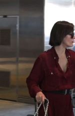 MILLA JOVOVICH Smoking a Cigarette at LAX Airport in Los Angeles 02/04/2017