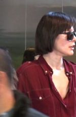 MILLA JOVOVICH Smoking a Cigarette at LAX Airport in Los Angeles 02/04/2017