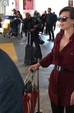 MILLA JOVOVICH Smoking a Cigarette at LAX Airport in Los Angeles 02/04/2017