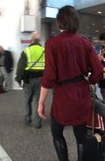 MILLA JOVOVICH Smoking a Cigarette at LAX Airport in Los Angeles 02/04/2017
