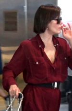 MILLA JOVOVICH Smoking a Cigarette at LAX Airport in Los Angeles 02/04/2017