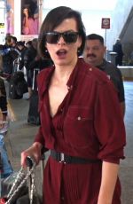 MILLA JOVOVICH Smoking a Cigarette at LAX Airport in Los Angeles 02/04/2017