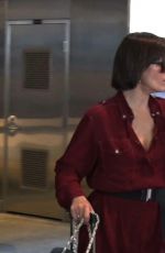 MILLA JOVOVICH Smoking a Cigarette at LAX Airport in Los Angeles 02/04/2017