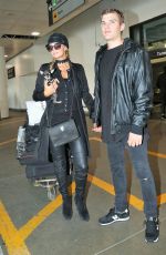 PARIS HILTON and Her Boyfriend Chris Zylka at Los Angeles International Airport 02/19/2017