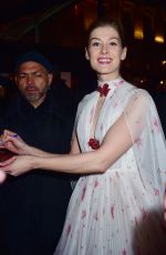 ROSAMUND PIKE Arrives at 