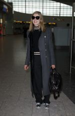 ROSAMUND PIKE at Heathrow Airport in London 02/03/2017