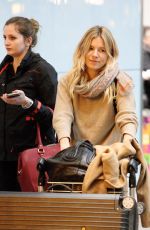 SIENNA MILLER at Heathrow Airport in London 02/15/2017