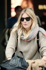 SIENNA MILLER at Heathrow Airport in London 02/15/2017