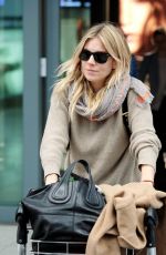 SIENNA MILLER at Heathrow Airport in London 02/15/2017