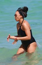 TIA MOWRY in Swimsuit at a Beach in Miami 02/27/2017