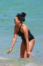 TIA MOWRY in Swimsuit at a Beach in Miami 02/27/2017