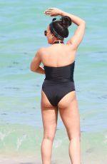 TIA MOWRY in Swimsuit at a Beach in Miami 02/27/2017