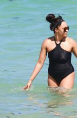TIA MOWRY in Swimsuit at a Beach in Miami 02/27/2017