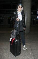 CARA DELEVINGNE Arrives at Los Angeles International Airport 03/12/2017