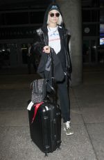 CARA DELEVINGNE Arrives at Los Angeles International Airport 03/12/2017
