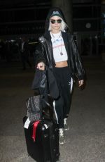 CARA DELEVINGNE Arrives at Los Angeles International Airport 03/12/2017