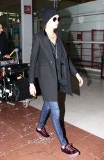 CARA DELEVINGNE at Charles De Gaulle Airport in Paris 03/04/2017