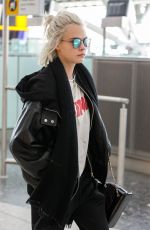 CARA DELEVINGNE at Heathrow Airport in London 03/26/2017