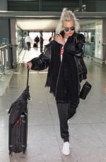 CARA DELEVINGNE at Heathrow Airport in London 03/26/2017