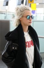 CARA DELEVINGNE at Heathrow Airport in London 03/26/2017