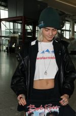 CARA DELEVINGNE at Heathrow Airport in London 03/12/2017
