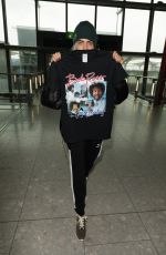 CARA DELEVINGNE at Heathrow Airport in London 03/12/2017