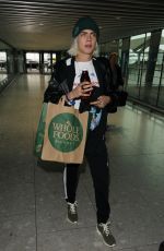 CARA DELEVINGNE at Heathrow Airport in London 03/12/2017