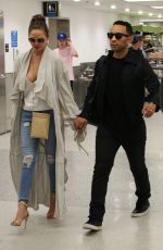 CHRISSY TEIGEN at Airpot in Miami 03/03/2017