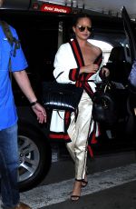 CHRISSY TEIGEN at LAX Airport in Los Angeles 03/16/2017