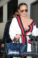 CHRISSY TEIGEN at LAX Airport in Los Angeles 03/16/2017