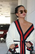 CHRISSY TEIGEN at LAX Airport in Los Angeles 03/16/2017