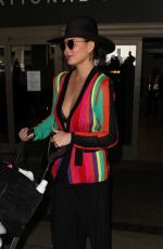 CHRISSY TEIGEN at LAX Airport in Los Angeles 03/23/2017