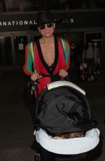 CHRISSY TEIGEN at LAX Airport in Los Angeles 03/23/2017