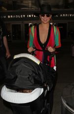 CHRISSY TEIGEN at LAX Airport in Los Angeles 03/23/2017