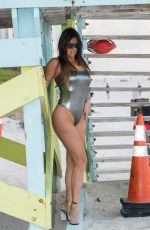 CLAUDIA ROMANI in Swimsuit at a Beach in Miami 03/11/2017