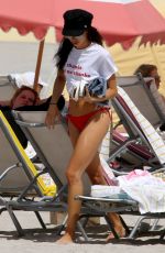 DANIELLE PEAZER in Bikini on the Beach in Miami 03/13/2017
