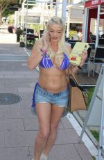 DANNIELLA WESTBROOK inDenim Shorts and Bikini Top Leaves Tantrum Beauty Salon in Marbella 03/11/2017