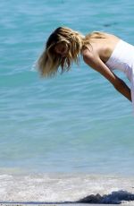 DEVON WINDSOR on the Set of a Photoshoot on the Beach in Miami 03/28/2017