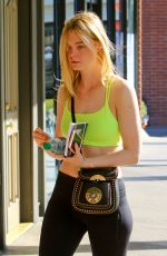 ELLE FANNING in Tights Out and About in Hollywood 03/14/2017
