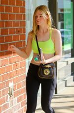 ELLE FANNING in Tights Out and About in Hollywood 03/14/2017